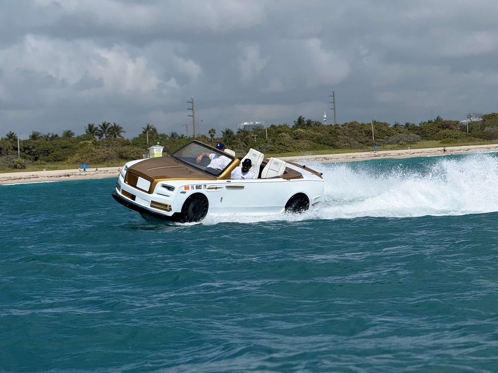 Jet car rental alternative: white and gold Rolls-Royce-inspired WaterBoatCar jetcar on Miami Beach waterway