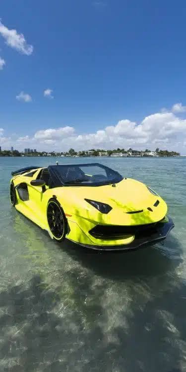 How to learn to operate a jet car — bright yellow Lamborghini-inspired WaterBoatCar jetcar being operated in clear shallow water