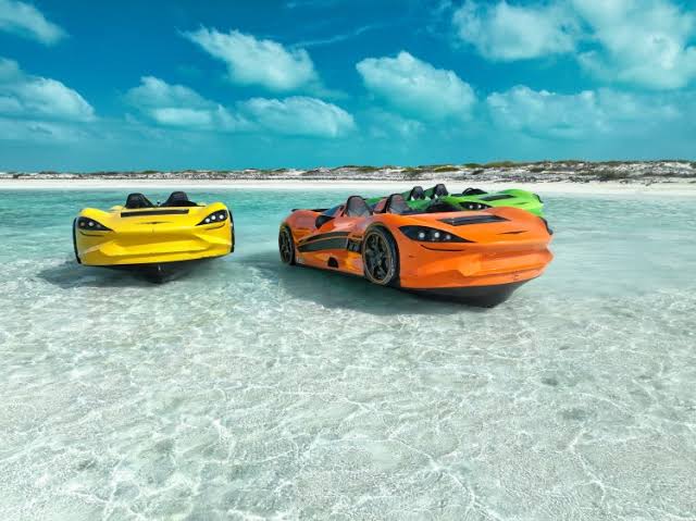 Where to buy a jet car: three WaterBoatCar jetcars in yellow, orange, and green on tropical beach shallows
